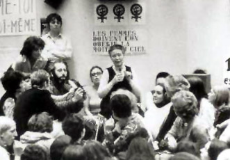 Simone de Beauvoir at Feminist Meeting.  Source:  http://www.phil-fak.uni-duesseldorf.de/frauenarchiv/europa/Beauvoir/beau.html