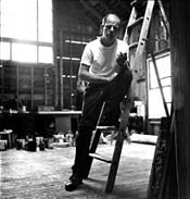 Jackson Pollock in his barn studio, summer-fall 1950. The picture credit is Hans Namuth. ©1998 Hans Namuth Ltd.